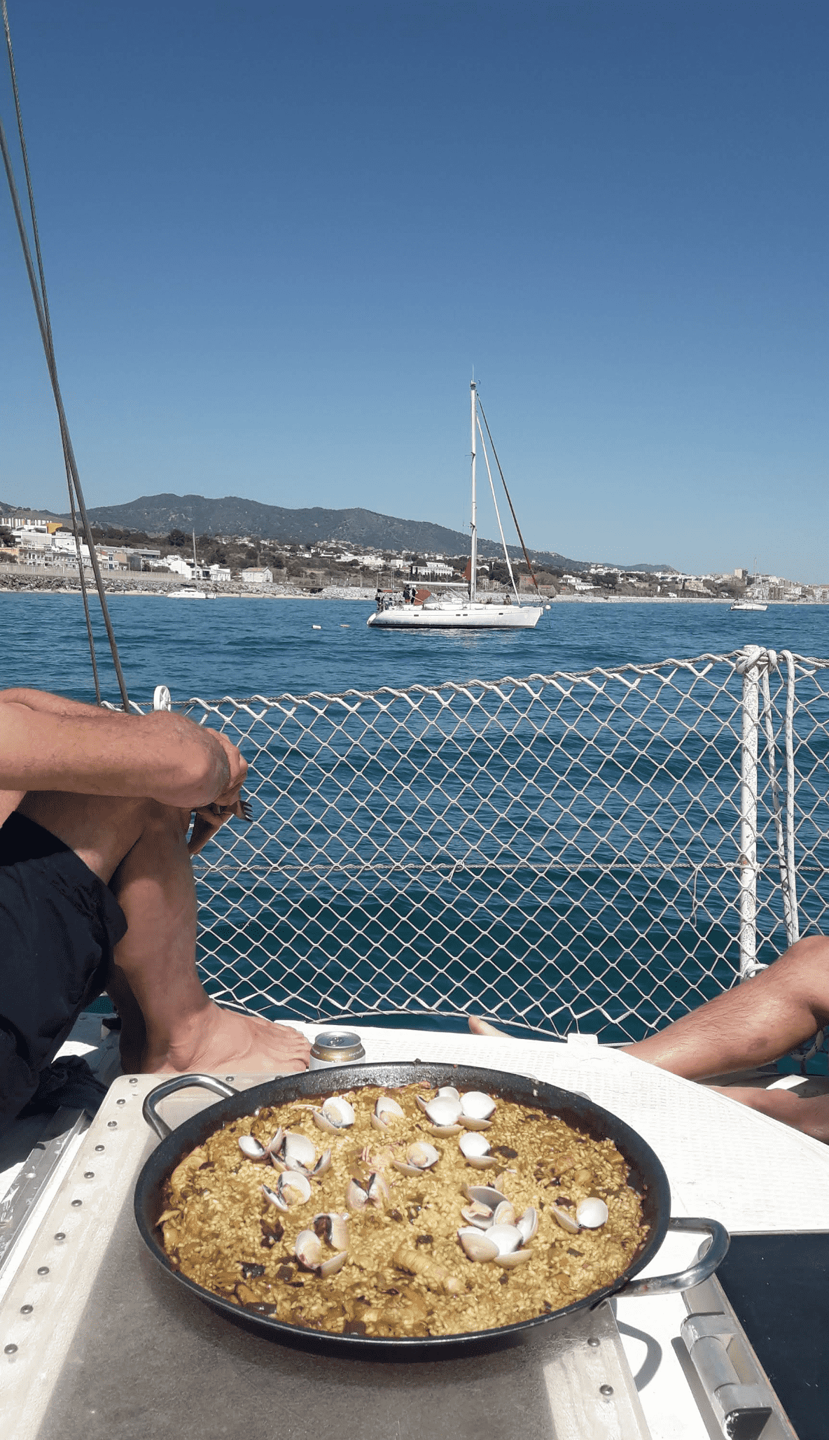 Fresh paella prepared on deck with Mediterranean views